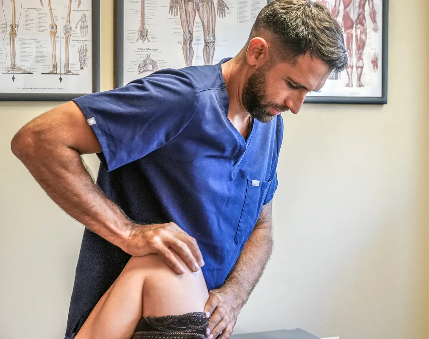 Guy Catz assessing a patient's hip and pelvis